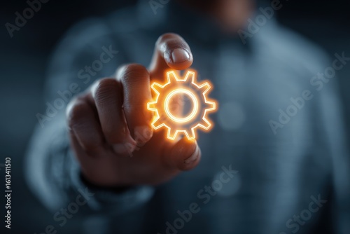 Person touching glowing gear graphic