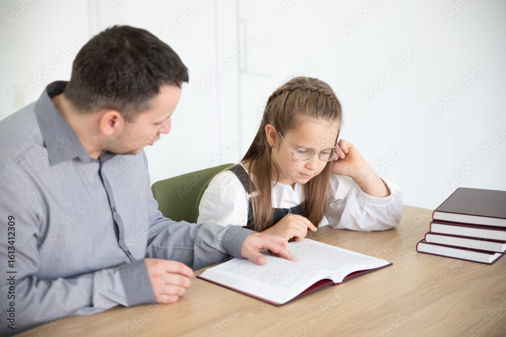 Fototapeta premium Father Assisting Daughter with Homework