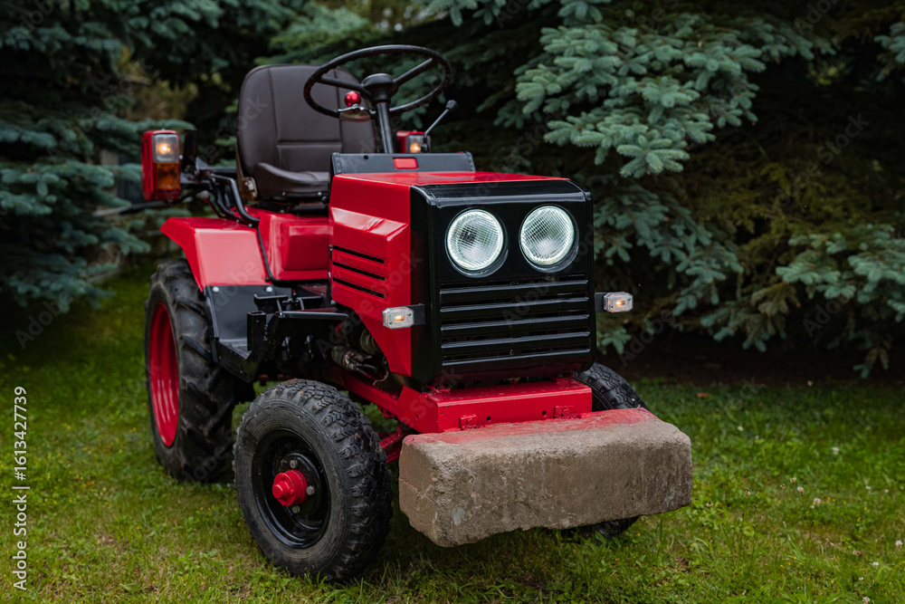 Obraz premium old red tractor in a field
