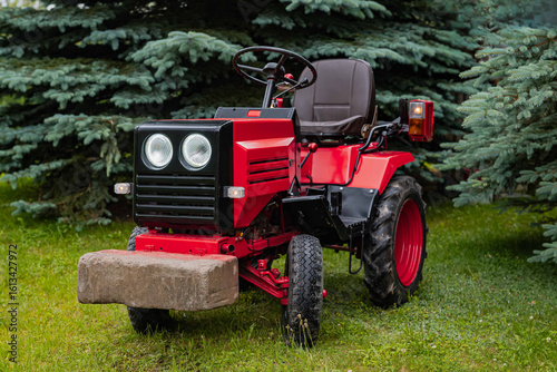old red tractor in a field