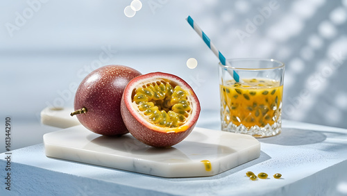 Passion fruits (whole and halved) with a glass of passion fruit juice