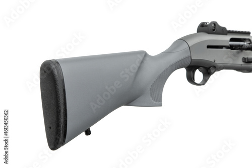 A close-up view of the gray synthetic buttstock of a shotgun, featuring a black rubber recoil pad and a textured grip area, isolated on a white back