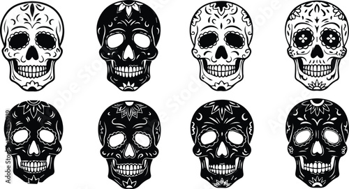 a collection of intricately decorated black and white sugar skulls with floral patterns, representing day of the dead