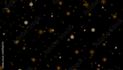 glowing golden sparkles and shimmering light particles on black background creating festive and elegant effect	