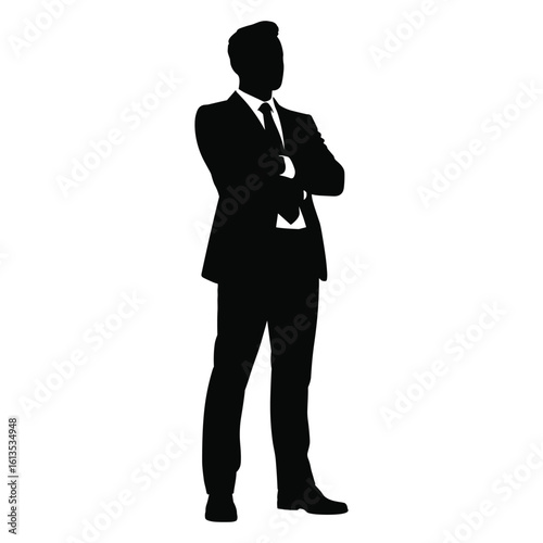 Silhouette of a confident businessman standing with arms crossed