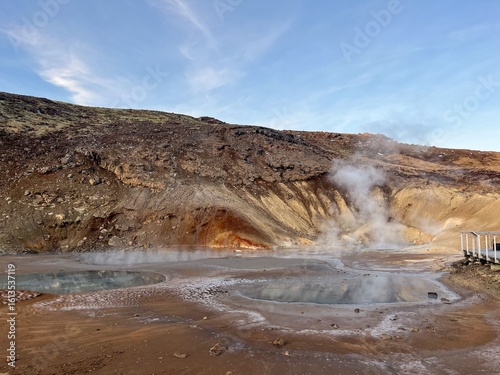 Geothermal Hot Spring in Iceland's Rocky Landscape