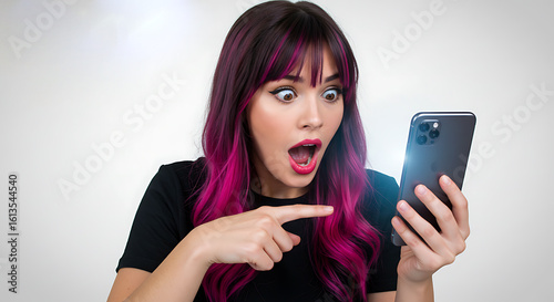 young woman using mobile phone Astonished young woman with pink hair reacts to shocking smartphone content; surprised, amazed expression; bright, vibrant, emotional stock photo.