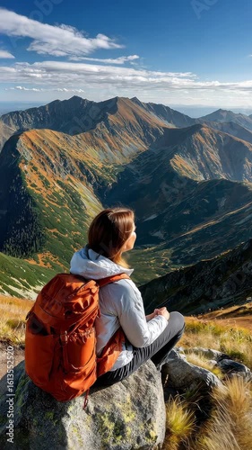 Hiking adventure in the mountains surrounded by stunning views at sunset