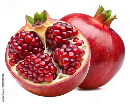 Vibrant ripe pomegranate halved revealing juicy arils against a dark background