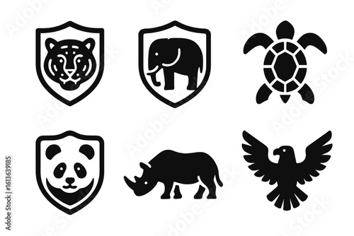 Endangered species icon set. Solid glyph icons for animal protection and wildlife conservation. Tiger, panda, elephant shield emblem. Turtle, rhino, eagle silhouette vector.