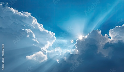 Sunbeams piercing through cumulus clouds
