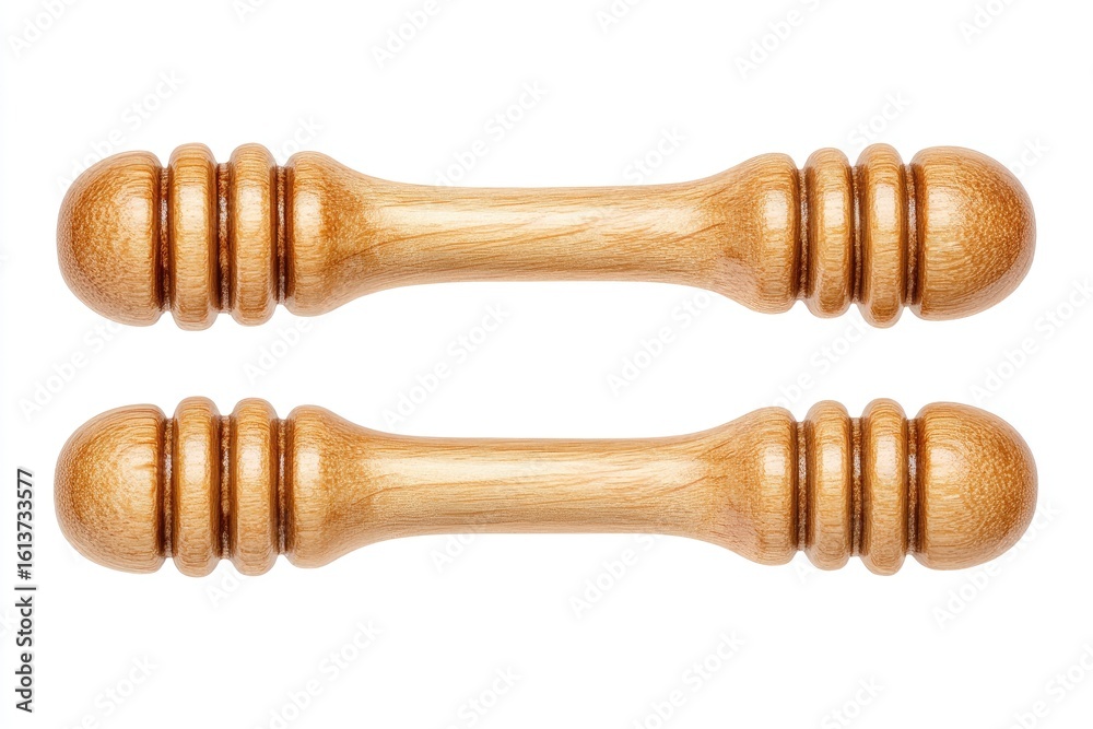Two light beige wooden honey dippers, parallel, isolated on white Two light beige wooden honey dippers, parallel, isolated on white