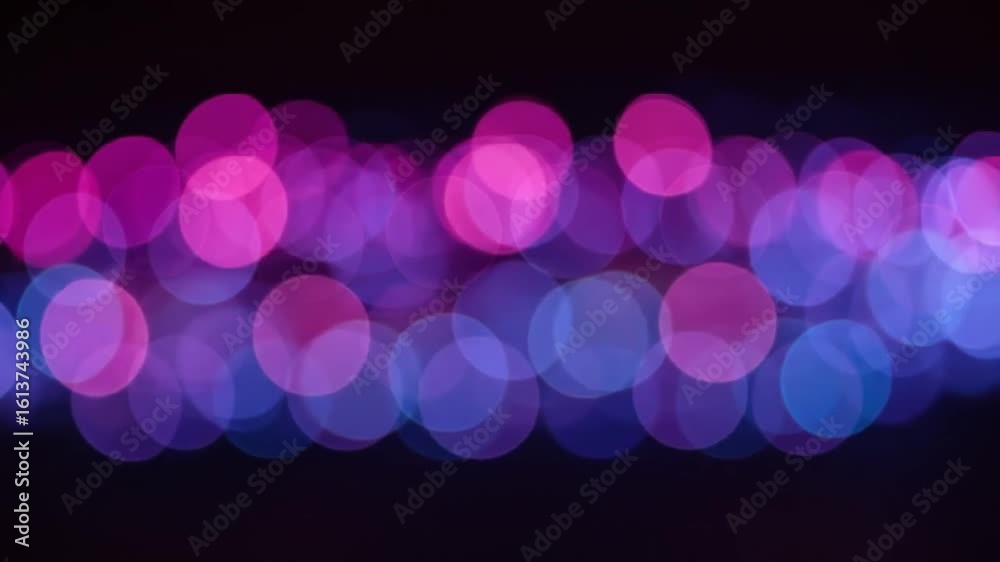 Abstract blurred lights in vibrant colors creating a dreamy atmosphere, ideal for background use