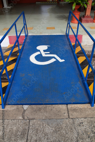 Wheelchair accessible steel bridge crossing the railway tracks