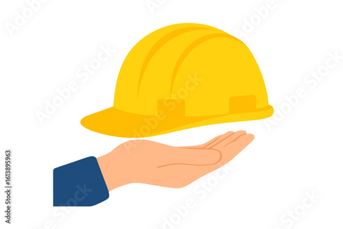 A yellow hard hat is positioned beside an orange work glove