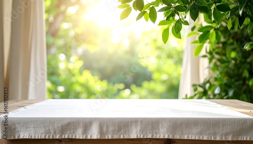 Fresh linens lay on wood table nature background.