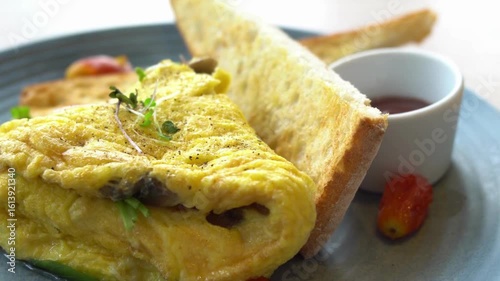 A delicious omelette with toast on a plate