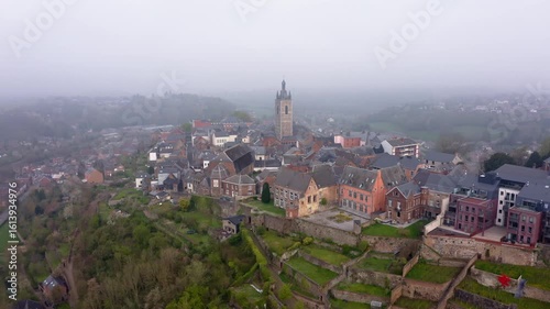 Wallpaper Mural Aerial view of the ancient Thuin cityscape, where a prominent tower rises amidst a cluster of buildings and terraced landscapes, Thuin, Wallonia, Belgium. Torontodigital.ca