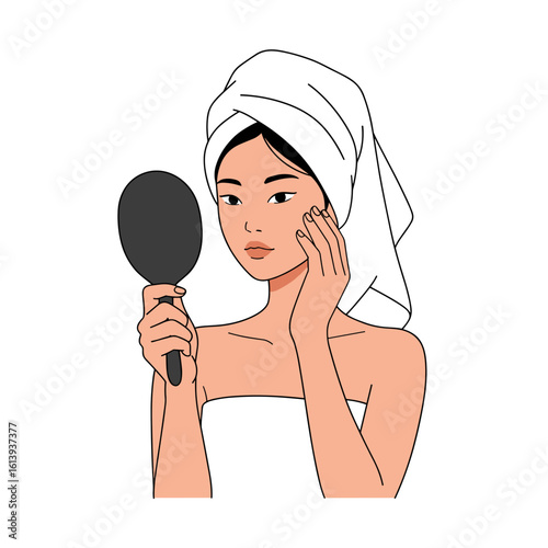 Young woman examining skin in mirror with towel on her head  