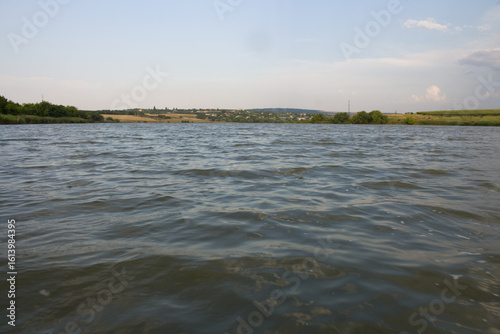 A body of water with land in the background