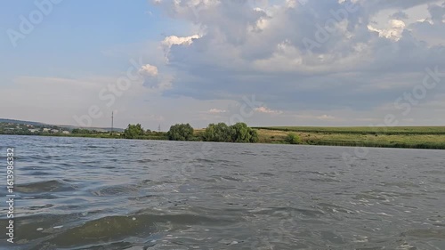 A body of water with land in the background