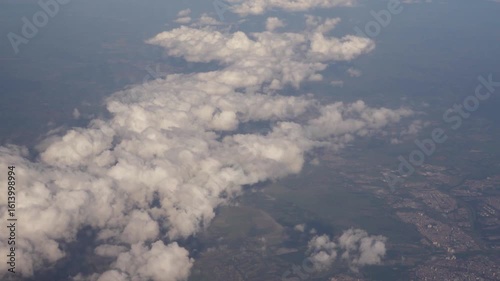 Aerial flying clouds over hills