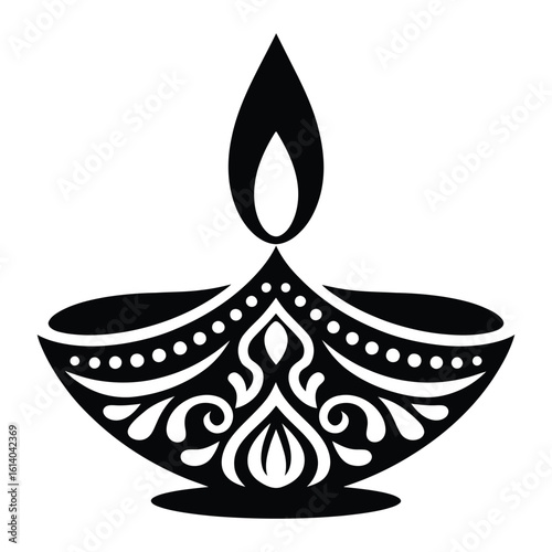 Ornate diya with flame lamp oil lamp