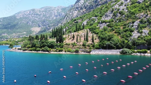 4K Drone Flight Over Risan Bay and Mountains Near Perast, Montenegro, Featuring Crystal Clear Water and Stunning Mountain Scenery on a Sunny Day