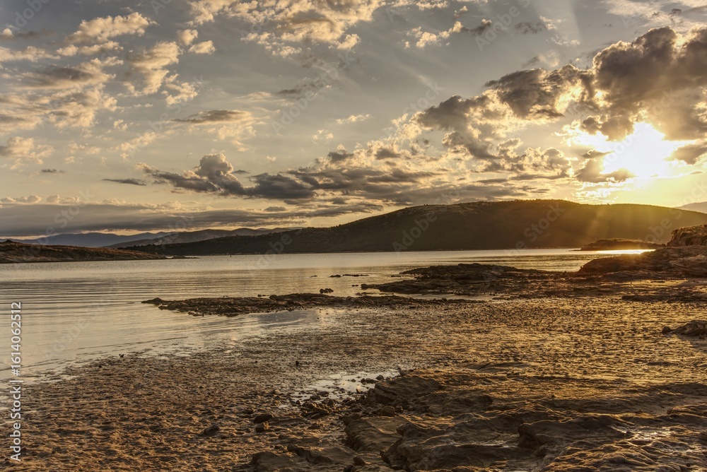 Naklejka premium Sandy beach on the island of Rab, Croatia in the morning with sunrise.