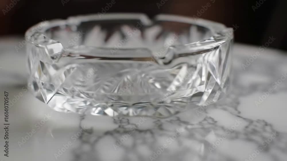 Elegant Crystal Ashtray on Marble Tabletop, Close-Up