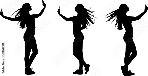 Silhouette of a woman taking a selfie with her smartphone, capturing modern digital culture and self-expression.
