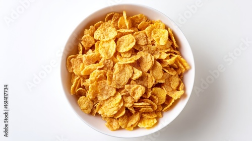 Top-down view of crunchy cornflakes served in a bowl on white background