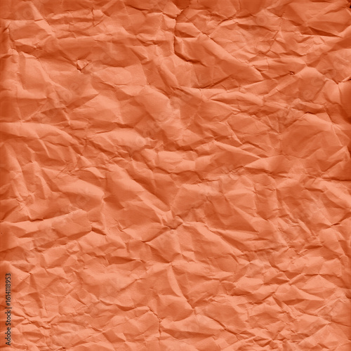 Photos Orange crumpled paper texture with heavy wrinkles and folds, ideal for bold design projects, posters, scrapbooking, creative backgrounds, and textured digital artwork