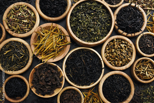 Colorful mix of tea varieties: red and black, green and white, oolong and herbal, selective focus, shallow DOF