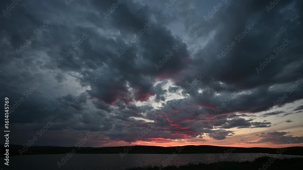 Afterglow over a highland lake and the clouds in the vast sky on a bright summer night in Norway, Vågå, Norwegian summer, 4K, 60fps, timelapse Afterglow over a highland lake and the clouds in the vast sky on a bright summer night in Norway, Vågå, Norwegian summer, 4K, 60fps, timelapse