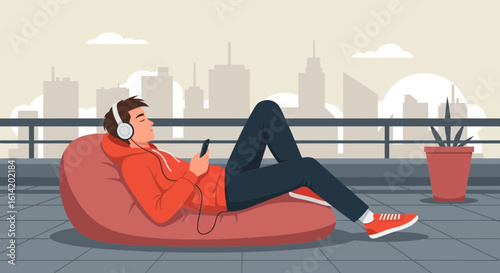Young Man Relaxes On The Roof Listening To Music And Enjoying The View