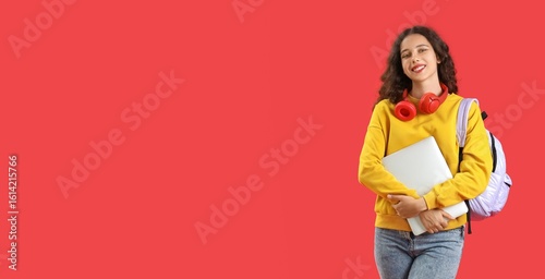 Female student with laptop ...