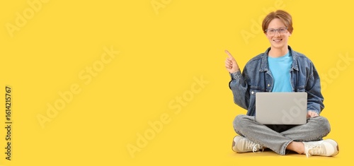 Male student with laptop po...