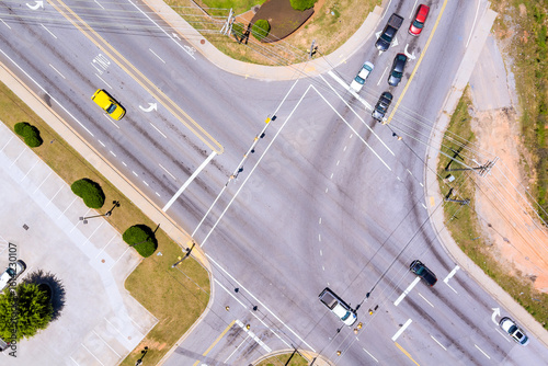 Quadro su tela Multi lane road intersection with vehicles traveling different directions roadwa