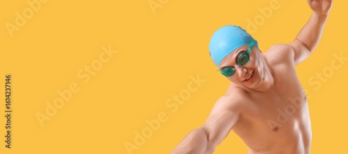 Male swimmer on yellow back...