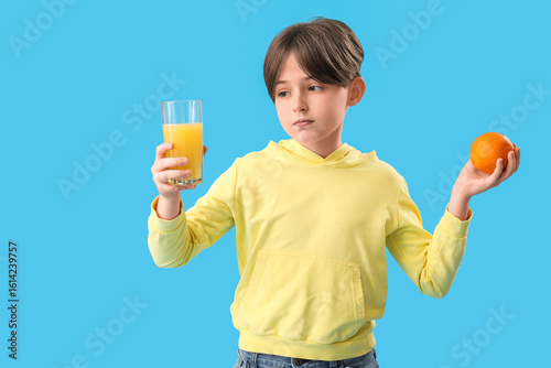 Little boy with orange and ...