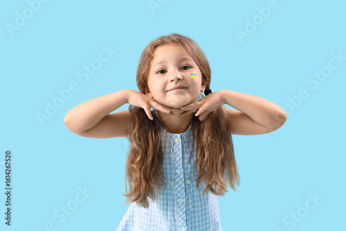 Happy little girl with draw...