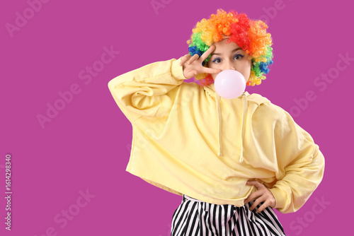 Trendy girl in clown costum...