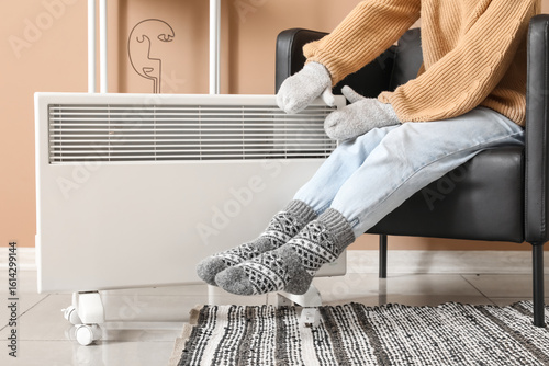 Young woman in warm socks a...