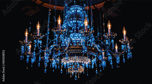 Elegant chandelier illuminated with blue lights and burning candles on a black background.