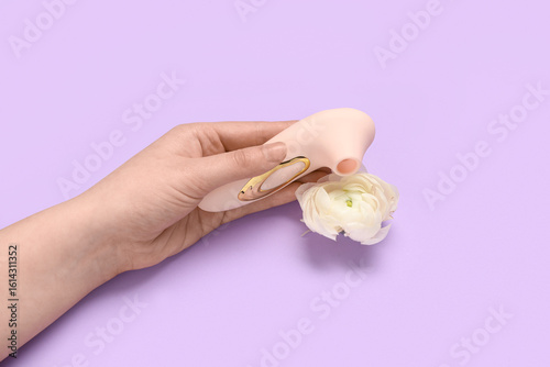 Female hand with vibrator a...