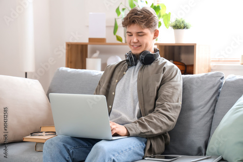 Male student studying onlin...
