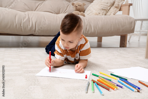 Cute little boy drawing wit...