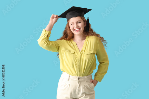 Happy female student in gra...