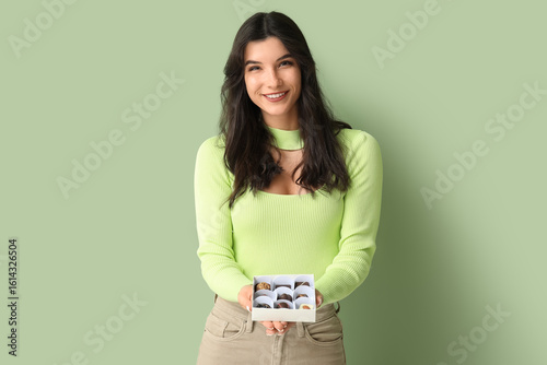 Young woman with box of tas...